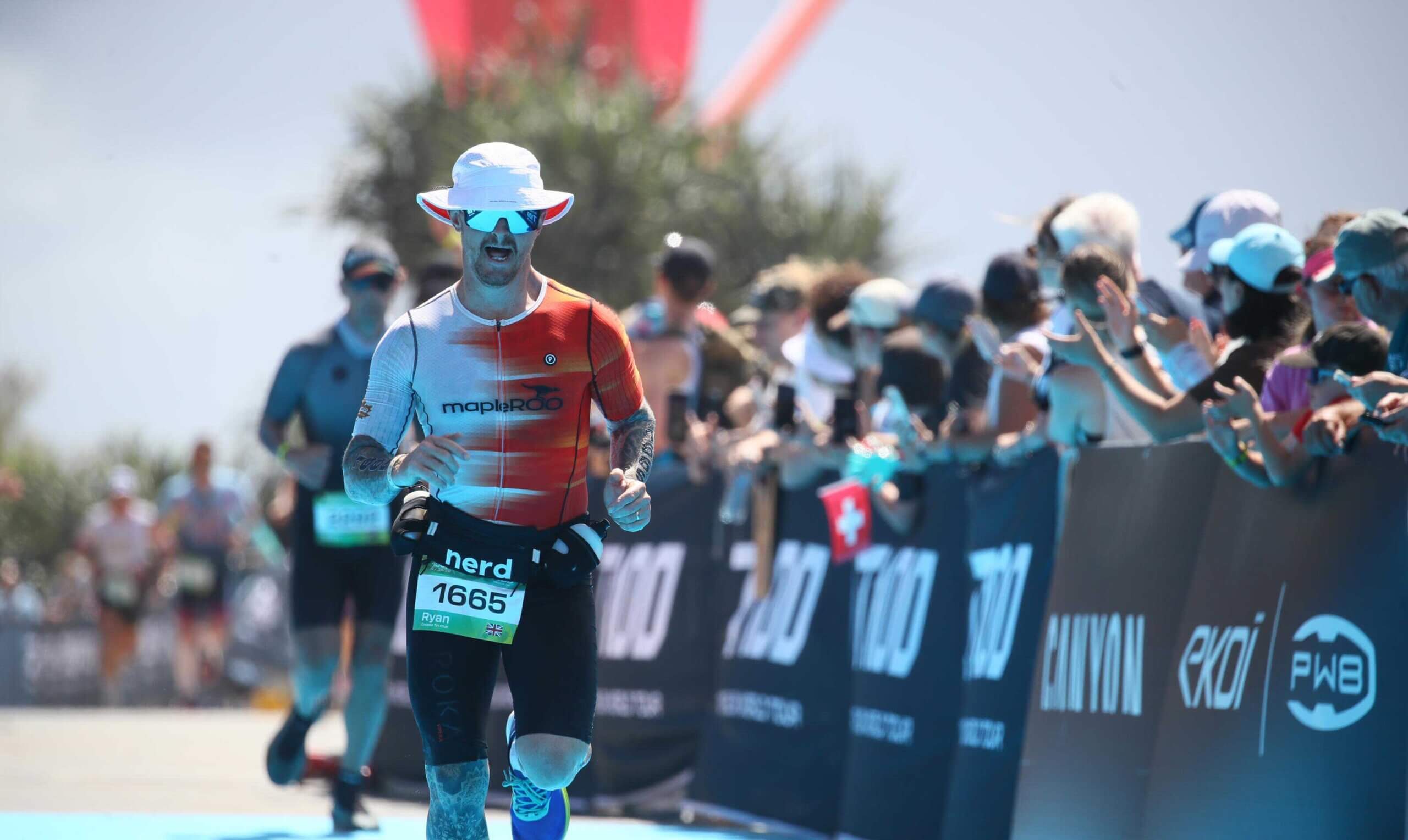 Runner approaching the finish line at a major endurance event